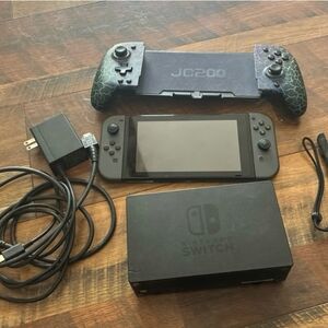 Nintendo Switch Console with Black and Blue Controllers